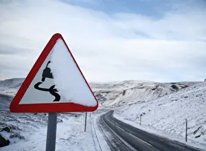 Trending: A slippery road warning sign is covered in snow on the A93 in Perthshire, Scotland