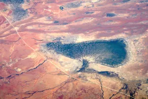 Weather Prints: Small dams and a dried-up lake can be seen next to a dirt road in outback Queensland