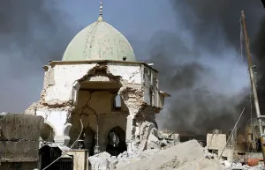 Mideast Prints: Smoke billows from the ruined Grand al-Nuri Mosque after it was retaken by the Iraqi