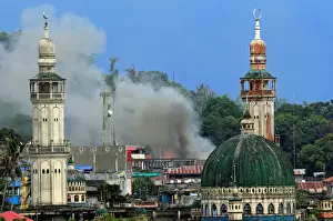 Philippines Prints: Smoke billows are seen as government troops continue their assault against insurgents