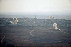 Smoke from explosions rises during fighting in the village of Jubata Al Khashab in Syria Smoke from explosions rises during fighting in the village of Jubata Al Khashab in Syria