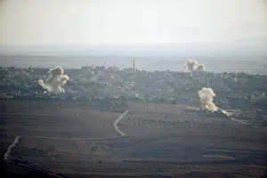 Mideast Prints: Smoke from explosions rises during fighting in the village of Jubata Al Khashab in Syria