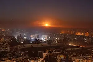 Smoke and flames rise after air strikes on rebel-controlled besieged area of Aleppo