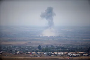 Mideast Prints: Smoke following an explosion in Syria is seen from the Israeli-occupied Golan Heights