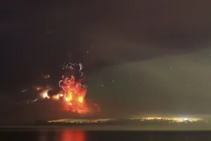 Volcano Prints: Smoke and lava spew from the Calbuco volcano, as seen from the shores of Lake Llanquihue