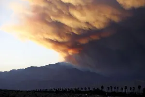 Wildfire Prints: A smoke plume from the Lake Fire in the San Bernardino National Forest is seen at sunset