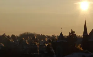 Smoke rises out of chimneys in the early morning in downtown Bern Smoke rises out of chimneys in the early morning in downtown Bern