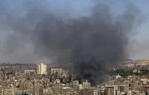 Smoke rises as a fire rages in central Cairo Smoke rises as a fire rages in central Cairo
