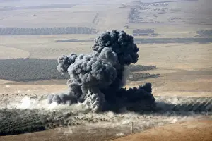 Mideast Prints: Smoke rises at Islamic State militants positions in the town of Naweran