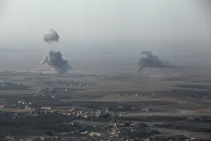Mideast Prints: Smoke rises at Islamic State militants positions in the town of Naweran
