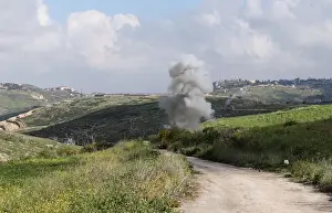 Lebanon Prints: Smoke rises from the Israeli drone after it crashed in Beit Yahoun village