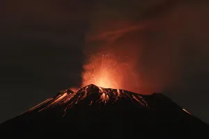 Mexico Prints: Smoke rises from the Popocatepetl as it spews incandescent volcanic material on