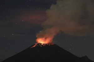 Mexico Prints: Smoke rises from the Popocatepetl as it spews incandescent volcanic material on