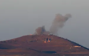 Mideast Prints: Smoke rises from Quneitra area