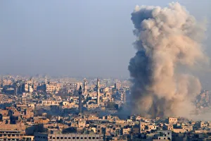 Mideast Prints: Smoke rises as seen from a government-held area of Aleppo