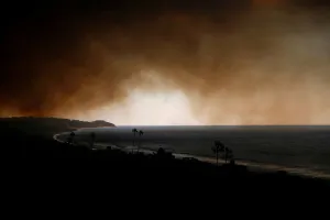California Prints: Smoke is seen over the ocean as the Woolsey Fire burns in Malibu