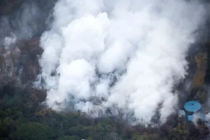 Hawaii Prints: Smoke and steam rise from a lava flow in the Leilani Estates subdivision during ongoing