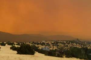 Smoke from the Wallow Wildfire rises over Round Valley High School Stadium in Smoke from the Wallow Wildfire rises over Round Valley High School Stadium in