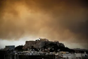 Greece Prints: Smoke from a wildfire burning outside Athens is seen over the Parthenon temple atop