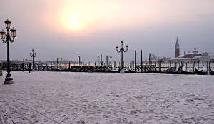 Images Dated 2018 February: Snow covered gondolas are seen near St. Marks square in Venice lagoon