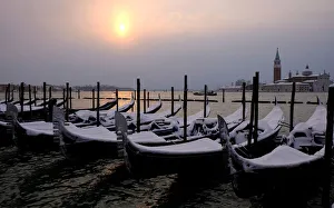 Images Dated 2018 February: Snow covered gondolas are seen near St. Mark square in Venice lagoon