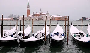 Images Dated 2018 February: Snow covered gondolas are seen near St. Marks square in Venice