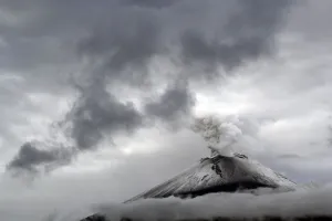 Mexico Prints: The snow-covered Popocatepetl volcano spews a cloud of steam high into the air in Puebla