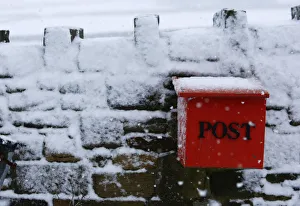 United Kingdom Prints: Snow covers a stone wall near Burnley, northern England
