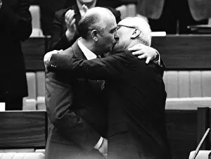 Soviet Leader Mikhail Gorbachev kissing East German Leader Erich Honecker