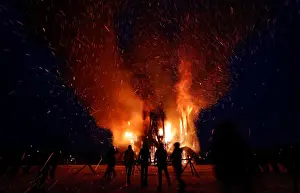 Images Dated 17th February 2018: Spectators look at the burning installation during a performance devoted to Maslenitsa in