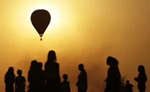 Prints of Spectators look at contestants competing in the National Ballooning Championship, held to commemorate Brazils independence day, in Brasilia September 7, 2011 Brazil Prints: Spectators look at contestants competing in the National Ballooning Championship