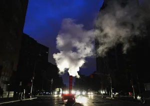 Sandy Prints: Steam rises from out of a vent in the middle of a blackout in the aftermath of Hurricane