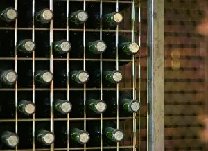 Stored bottles lay in a wine cellar during season of grape harvest in La Rioja
