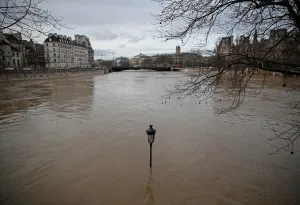 A street-lamp is seen on the flooded banks of the Seine River in Paris A street-lamp is seen on the flooded banks of the Seine River in Paris