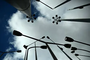 Spain Prints: Street lights are silhouetted against the sky in Bilbao