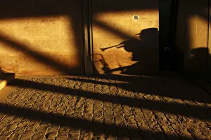 France Prints: A street musician performs under a bridge in Paris
