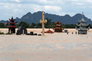 Images Dated 2018 July: Submerged tombs are seen at a flooded village after heavy rainfall in Ninh Binh province