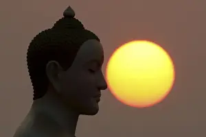 Thailand Prints: The sun rises next to a Buddha statue while monks and novices gather to receive alms
