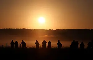 United Kingdom Prints: The sun rises as revellers welcome in the Summer Solstice at the Stonehenge stone circle