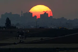 Prints of The sun sets over the Gaza Strip, as seen from the Israeli side of the border May 15, 2018. REUTERS/Amir Cohen Israel Prints: The sun sets over the Gaza Strip, as seen from the Israeli side of the border