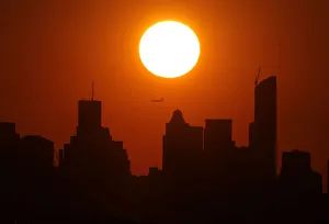 The sun sets over New York city as viewed from the Arthur Ashe Stadium, venue of the U.S The sun sets over New York city as viewed from the Arthur Ashe Stadium, venue of the U.S