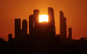 Cityscape Prints: The sun sets behind the skyscrapers of the Moscow International Business Centre in Moscow