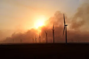Images Dated 2018 April: The sun sets through smoke from the Rhea fire on a wind farm near Seiling