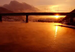 Prints of The sun sets over the Yenisey River near Russias second largest hydroelectric power station by the town of Divnogorsk some 40 km (25 miles) from the major Siberian city of Krasnoyarsk January 5 Russia Prints: The sun sets over the Yenisey River near the hydroelectric power station by the town