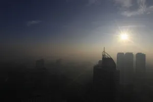 Philippines Prints: The sun shines on the first day of 2014 as smog from the New Year revelry covered high