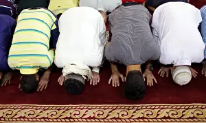 Sunni Muslims perform Eid al-Fitr prayers marking the end of the holy fasting month of