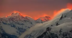 Landscapes Prints: The sunset illuminates the peaks of the mountains near the Swiss mountain resort of St