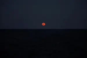 A super blood blue moon rises in central Mediterranean Sea
