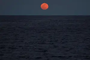 Images Dated 31st January 2018: A super blood blue moon rises in central Mediterranean Sea