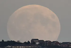 A supermoon rises above Brighton in southern England